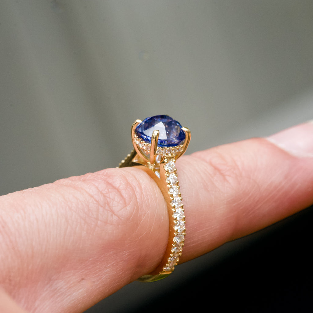 yellow gold blue sapphire engagement ring hidden halo