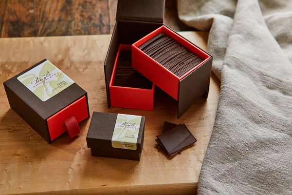 Small, medium, and large boxes of thin dark chocolate slivers