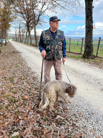 An Italian truffle hunter and his dog.