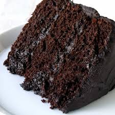slice of dark chocolate cake lying on its side