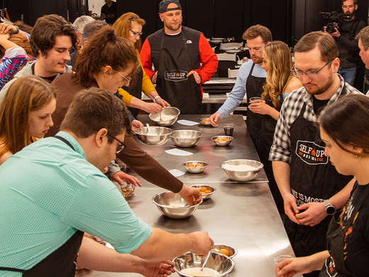 Adult Cooking Activity | People around table cooking