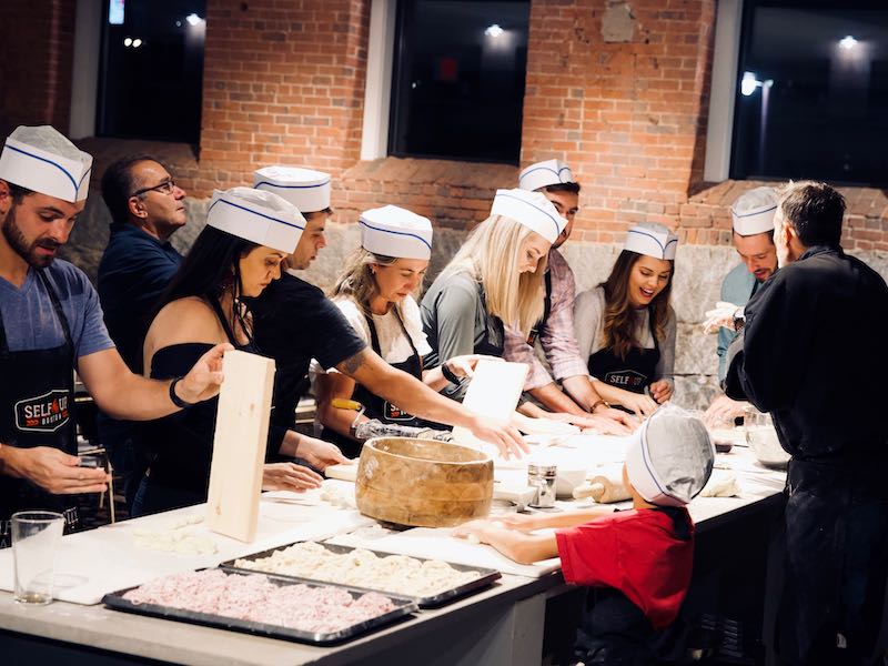 Fun Team Building Activity in NYC | Team cooking food