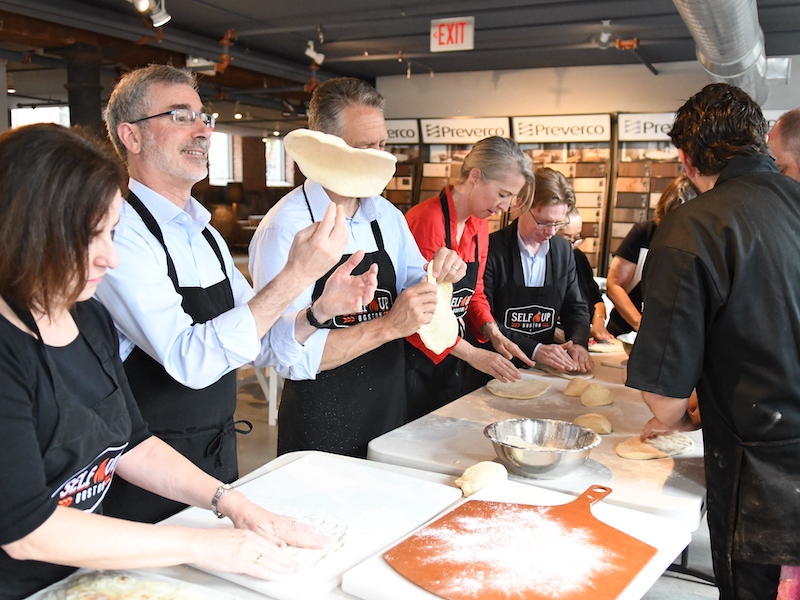 Group Cooking Class | people preparing pizza