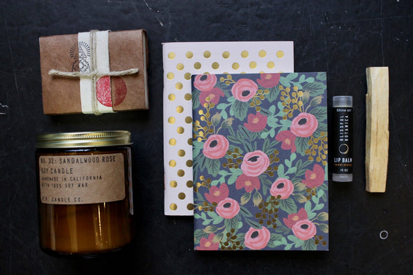 stationary kits with an amber candle jar layout