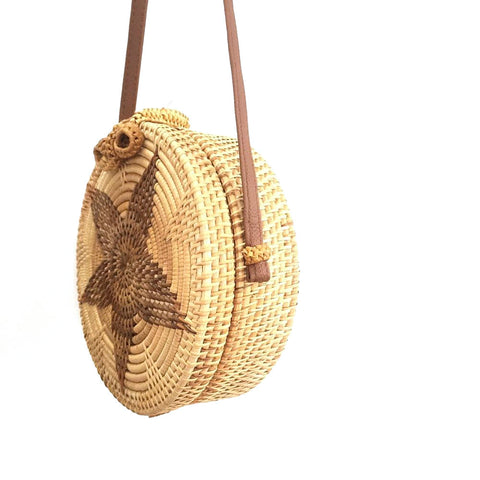 round woven wicker shoulder bag with star