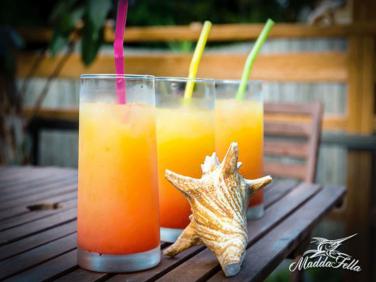 A beautiful tequila sunrise sitting on a table.