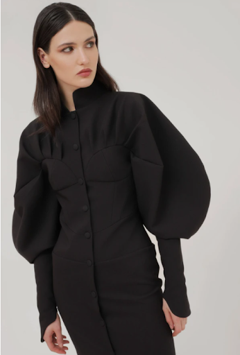 Model wearing a puffy black outfit