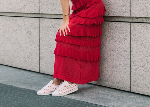 A woman modeling The Nou Project sneakers.