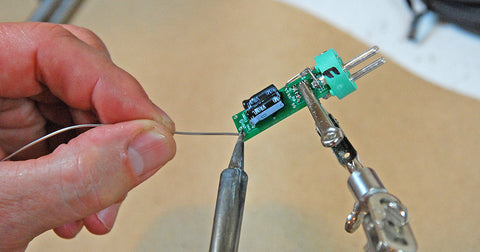 Bruce Bartlett soldering a circuit board