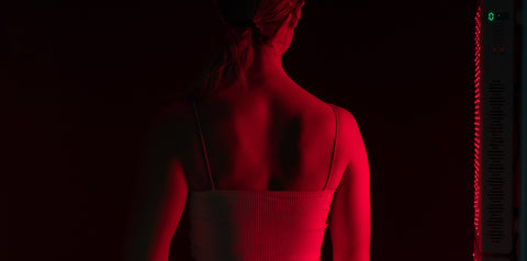red light therapy shining on back
