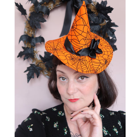 Woman wears witch hat