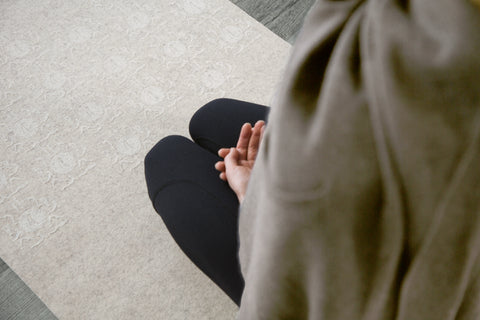 Dana McKenzie wrapped in a shawl on her yoga mat - Pure NZ Wool Yoga Mat - Yolana | Eco Yoga Store