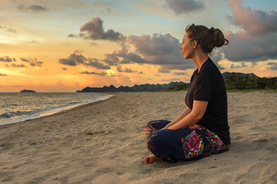 Yogi meditation at the beach | Eco Yoga Store