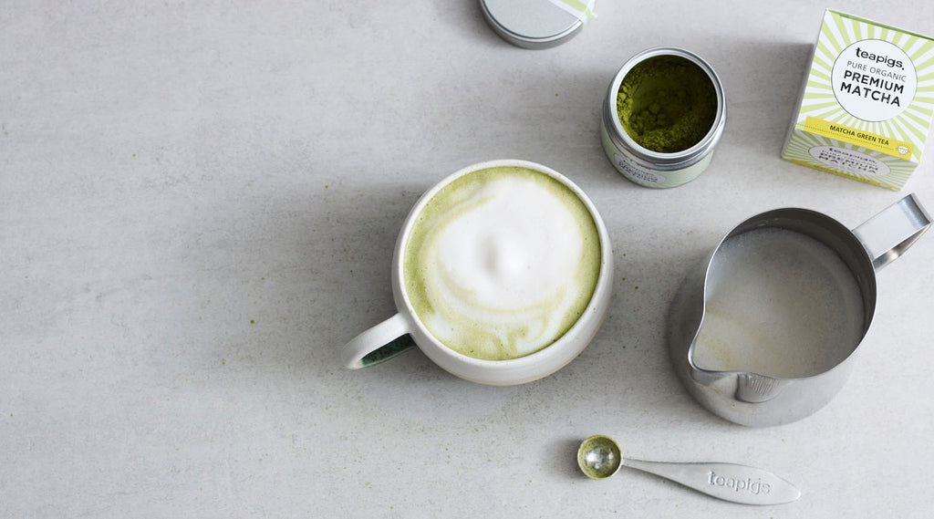 a mug filled with a warm matcha latte