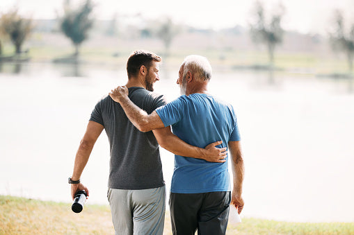 Healthy middle aged man with his healthy senior father because they take Zinc and Collagen for longevity and men's health.