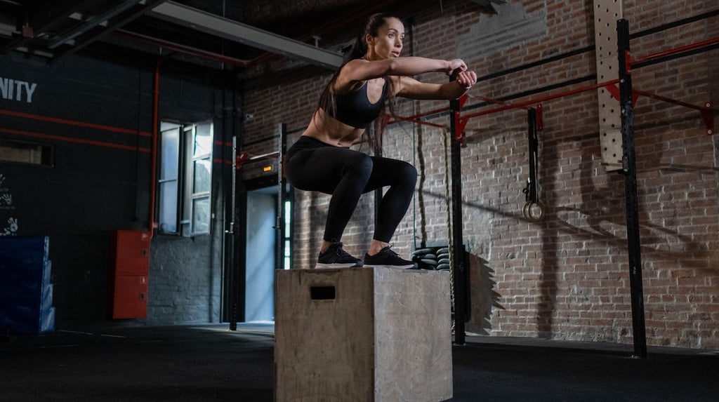 girl doing box jumps