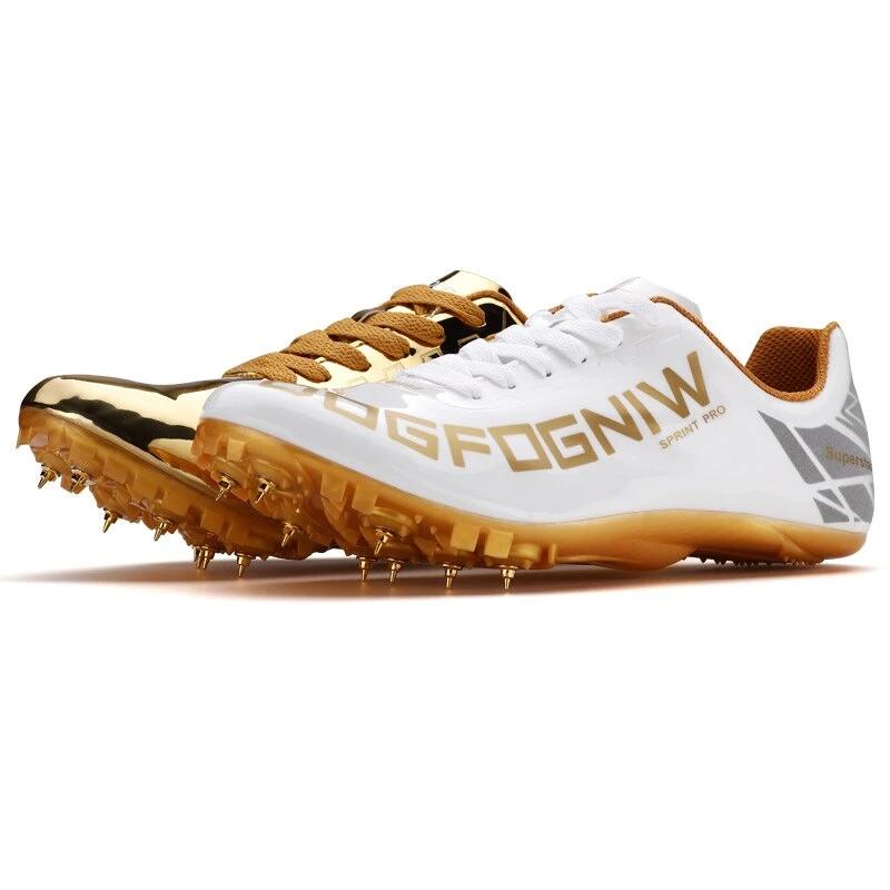 white and gold track spikes