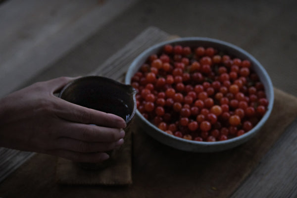 teaware and seasonal cherries in Yunnan, China