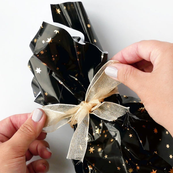 Make this quick gift bag out of wrapping paper when it's midnight on  Christmas eve and you wind up with an oddly-shaped gift and no more  available bags.