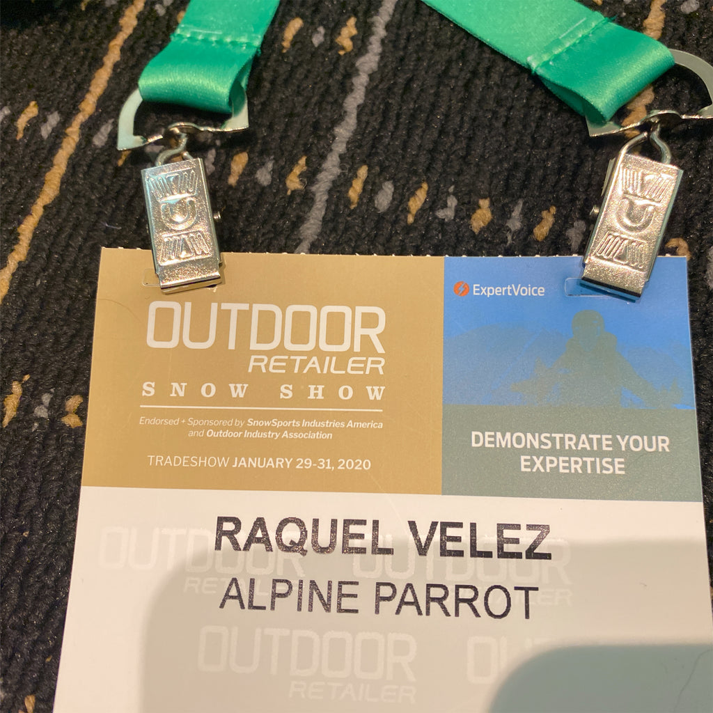An Outdoor Retailer attendee badge for Alpine Parrot CEO and Founder, Raquel, dated January 2020. 