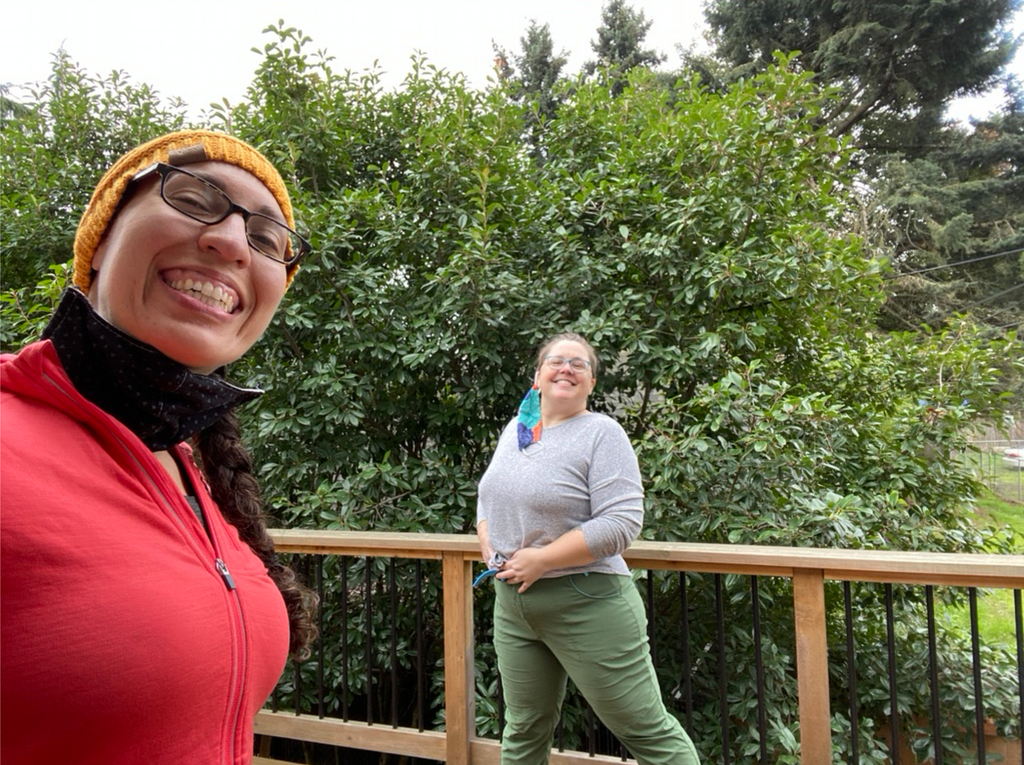Raquel smiling and taking a selfie with one of the Alpine Parrot fit testers. 