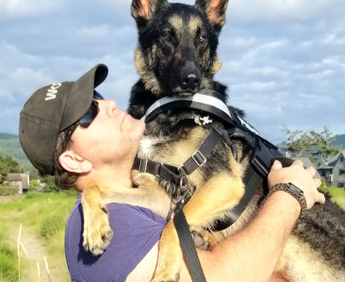 “The most rewarding is hearing stories from veterans who had mental health crisis and a dog we trained saved them” – Campbell with his dog, Fergus