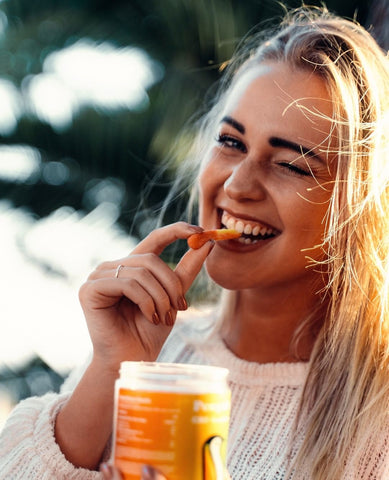 Woman eating CBD Gummies