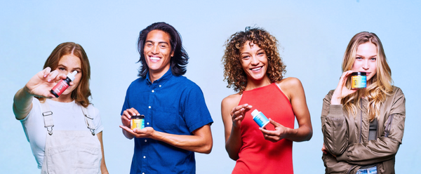 4 people holding CBD products
