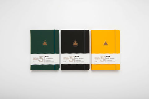 Power of 3 undated goal planners in forest green, charcoal and sunshine yellow