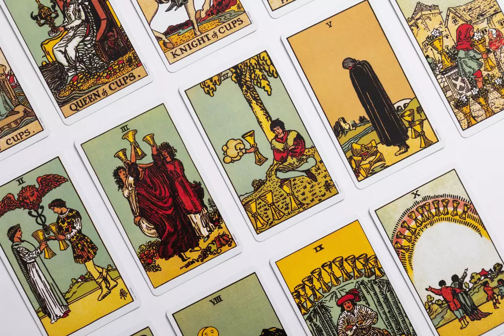 Various tarot cards in red and yellow colours