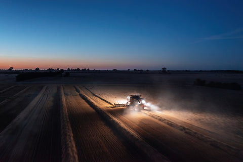 tractor sowing seed at night