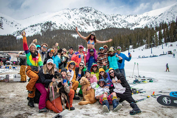 Skiers celebrate at the Beach at the base of A-Basin