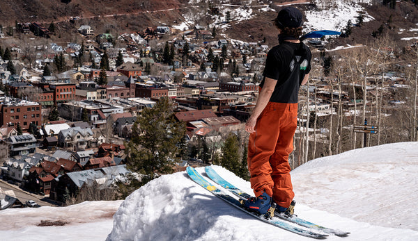 Skier Benni Solomon overlooks town off of a jump.