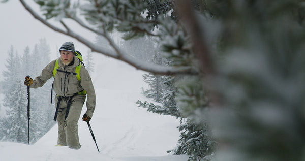 Drew Petersen skis in the woods