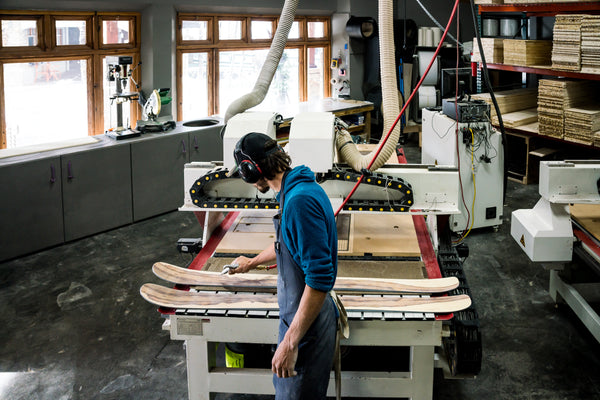 A Wagner Skis employee double checks a pair of wood veneer skis at the factory.