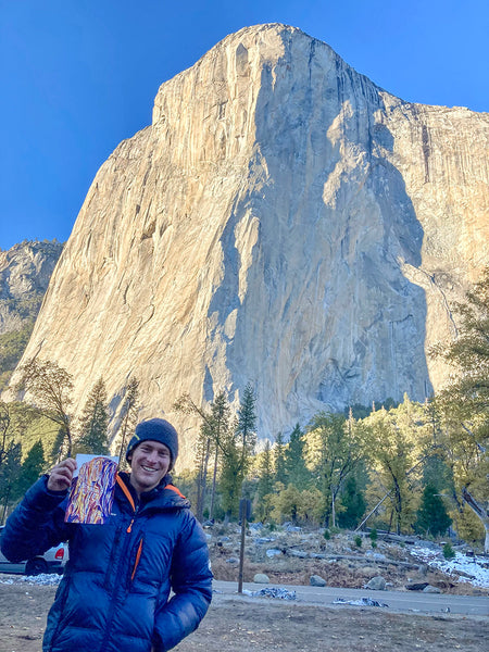 Jack Plantz stands in front of El Capitan with one of the images that inspired his ski designs.