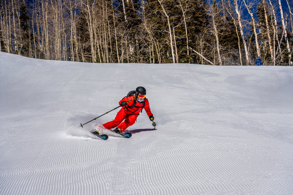 An ex-racer carves up a freshly groomed trail.