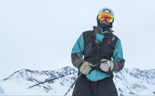 Nadar Jamal smiles while taking a moment on skis.