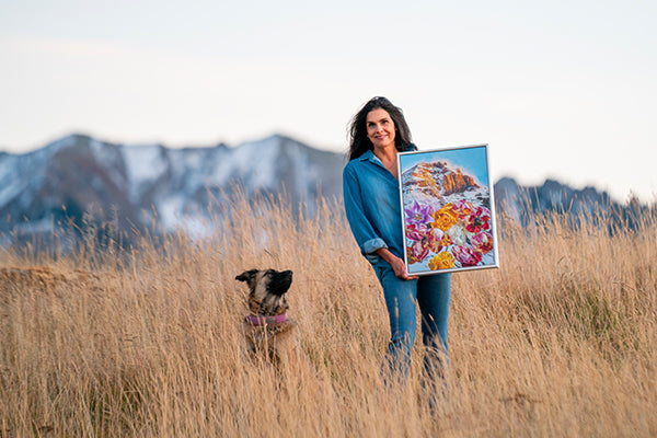 Nicole Finger with one of her paintings