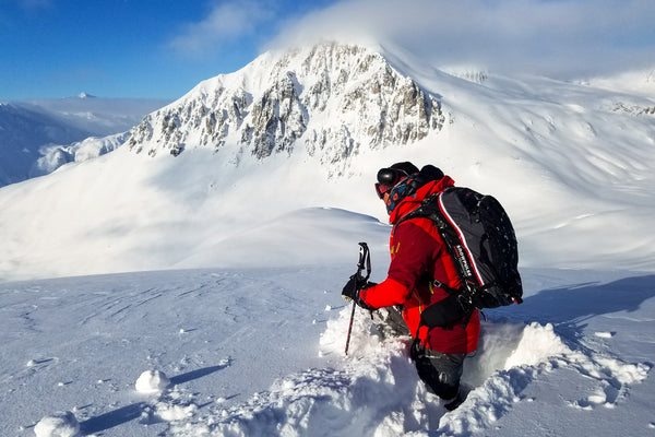 A guide looks over the terrain at Tordrillo Mountain Lodge, Alaska