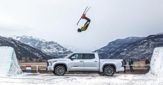 Woody Smith backflips over a truck at the Ridgway Skijor event.