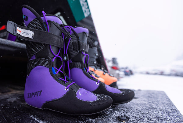 Zip fit ski boot liners sit in a car boot.