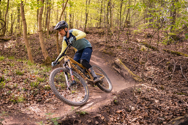 Downhill mountain biker in the forest