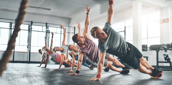 Men performing yoga moves.