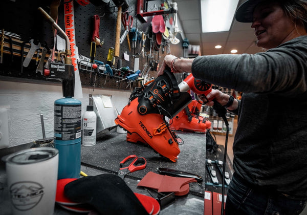 Sam Tish fixes boots