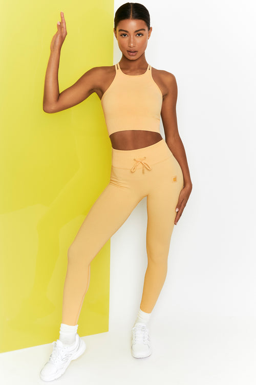 Running Arm Slogan Crop Top and Contrast Piping Detail Flared Leggings Set