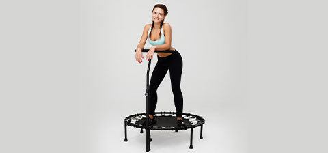 women exercising on a black trampoline