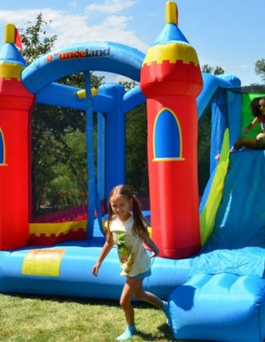 a girl playing around the inflatable bouncers