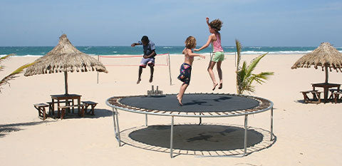 kids jumping on a medium size trampoline