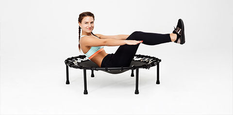 women exercising on a small trampoline